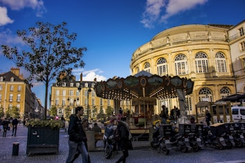 people walking near beige concrete building during daytime