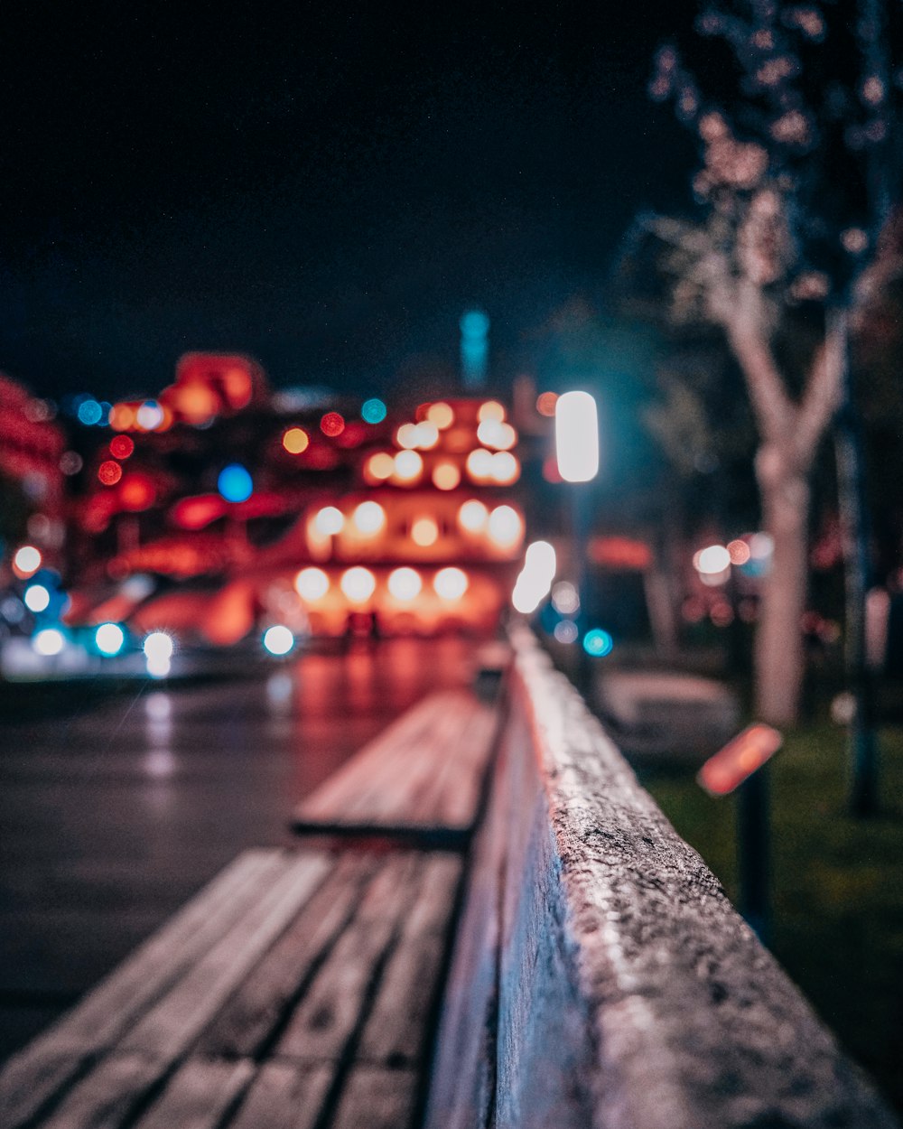 bokeh photography of a road during night time