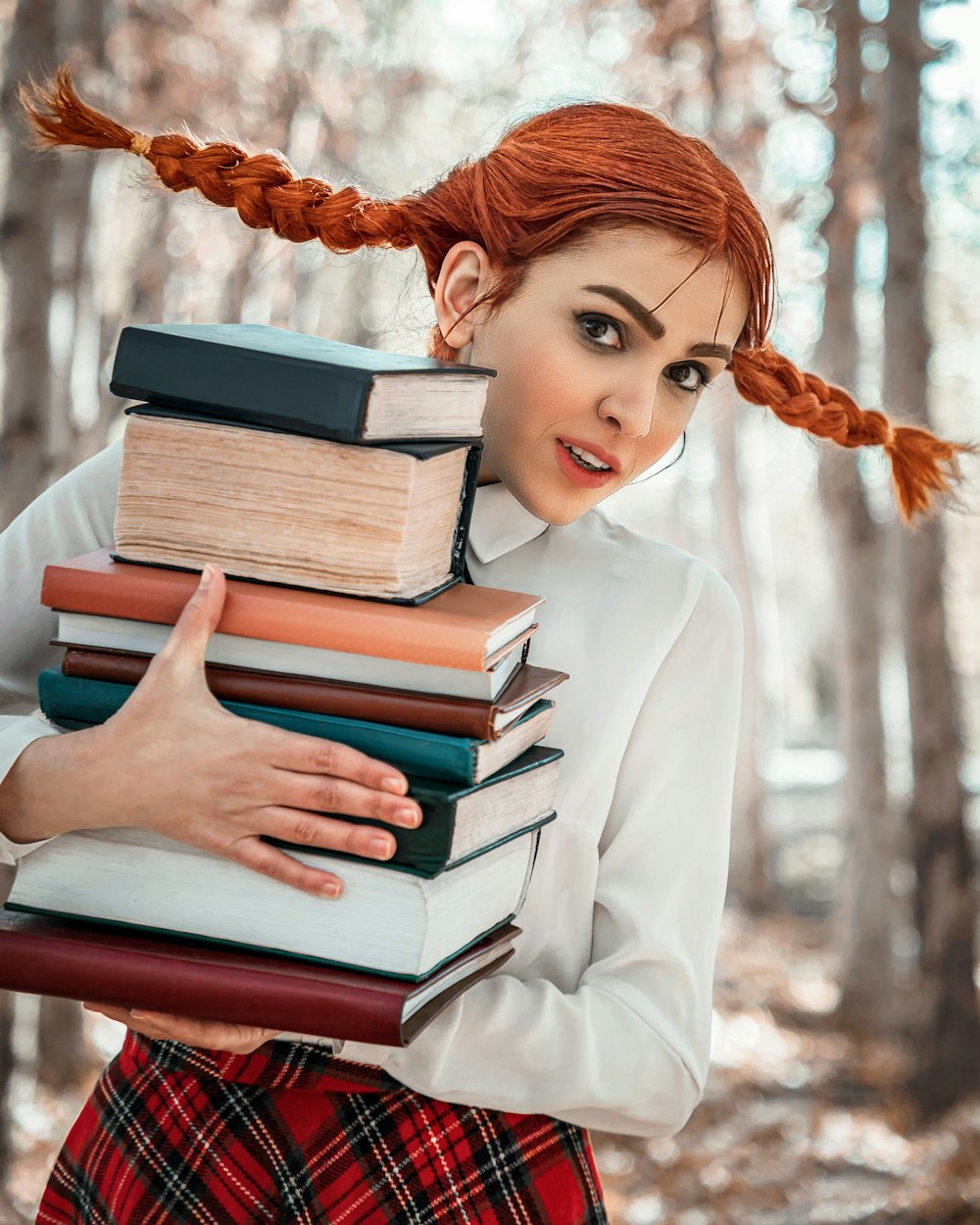 woman in white long sleeve shirt reading books