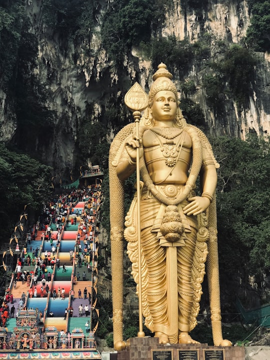 gold statue of a man in Batu Caves Malaysia