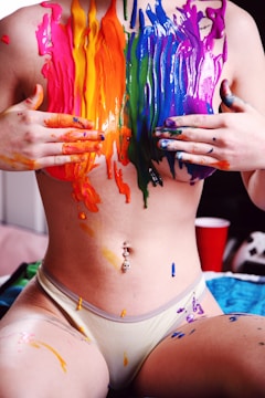 woman with blue red and yellow paint on her body
