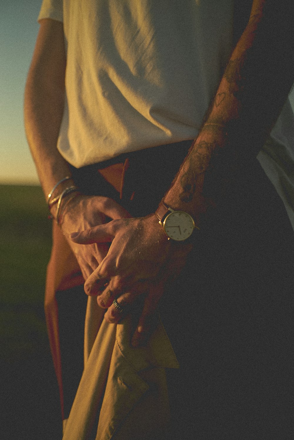 man in white shirt wearing black watch