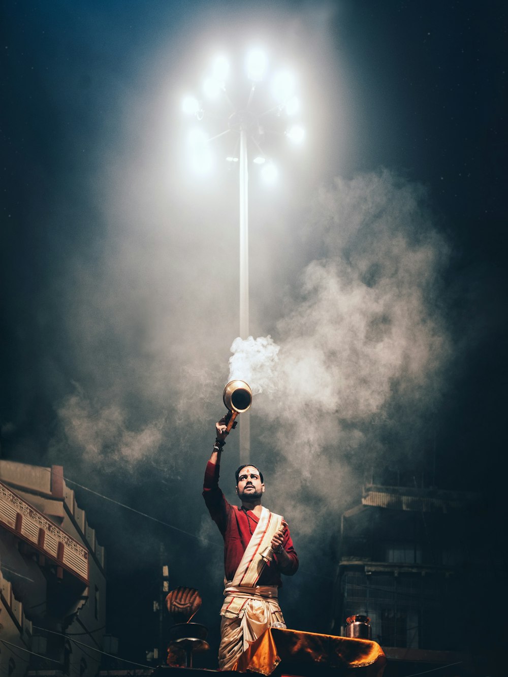 man in red and white jacket holding white and red flag