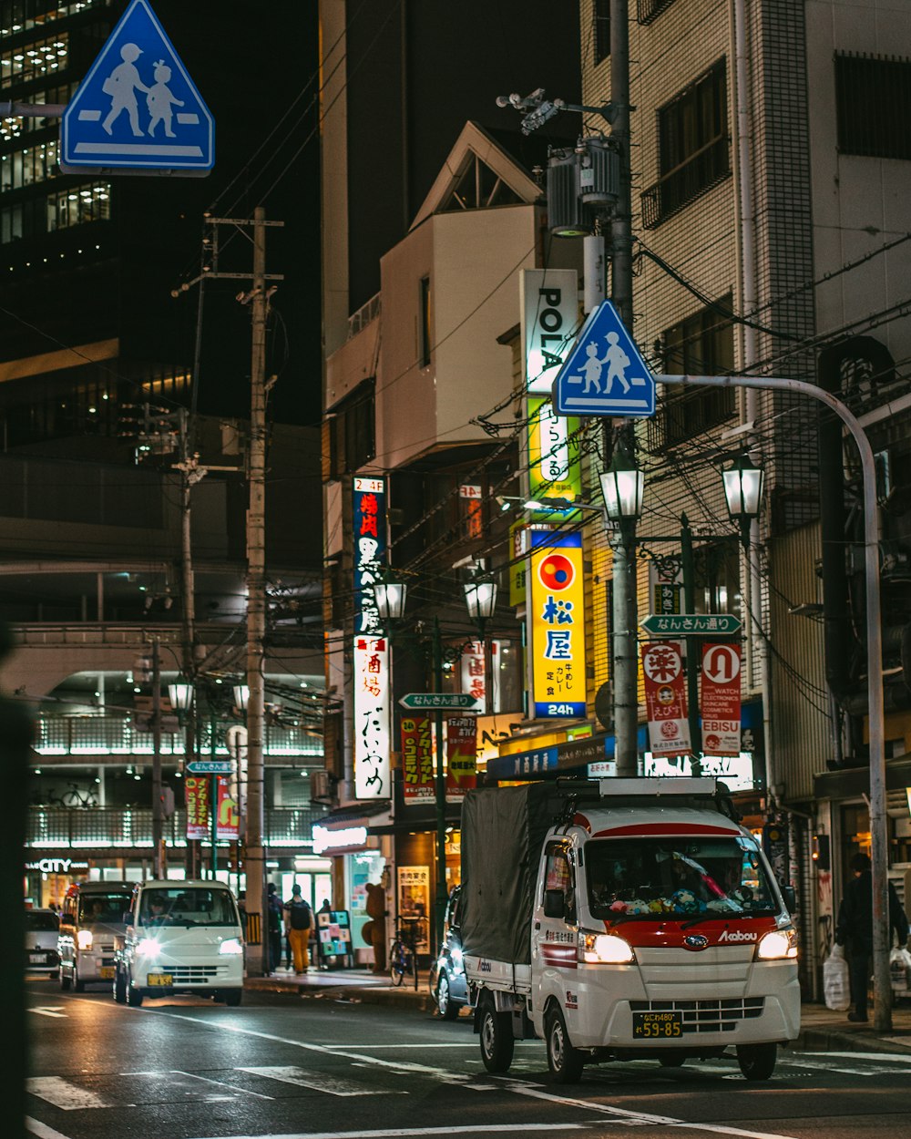 white and red van on road during night time