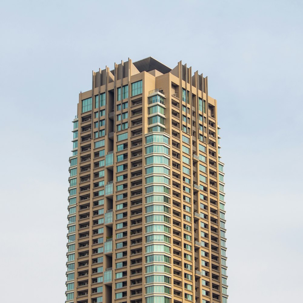 brown concrete building under gray sky