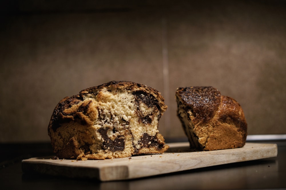 two brown bread on brown wooden tray