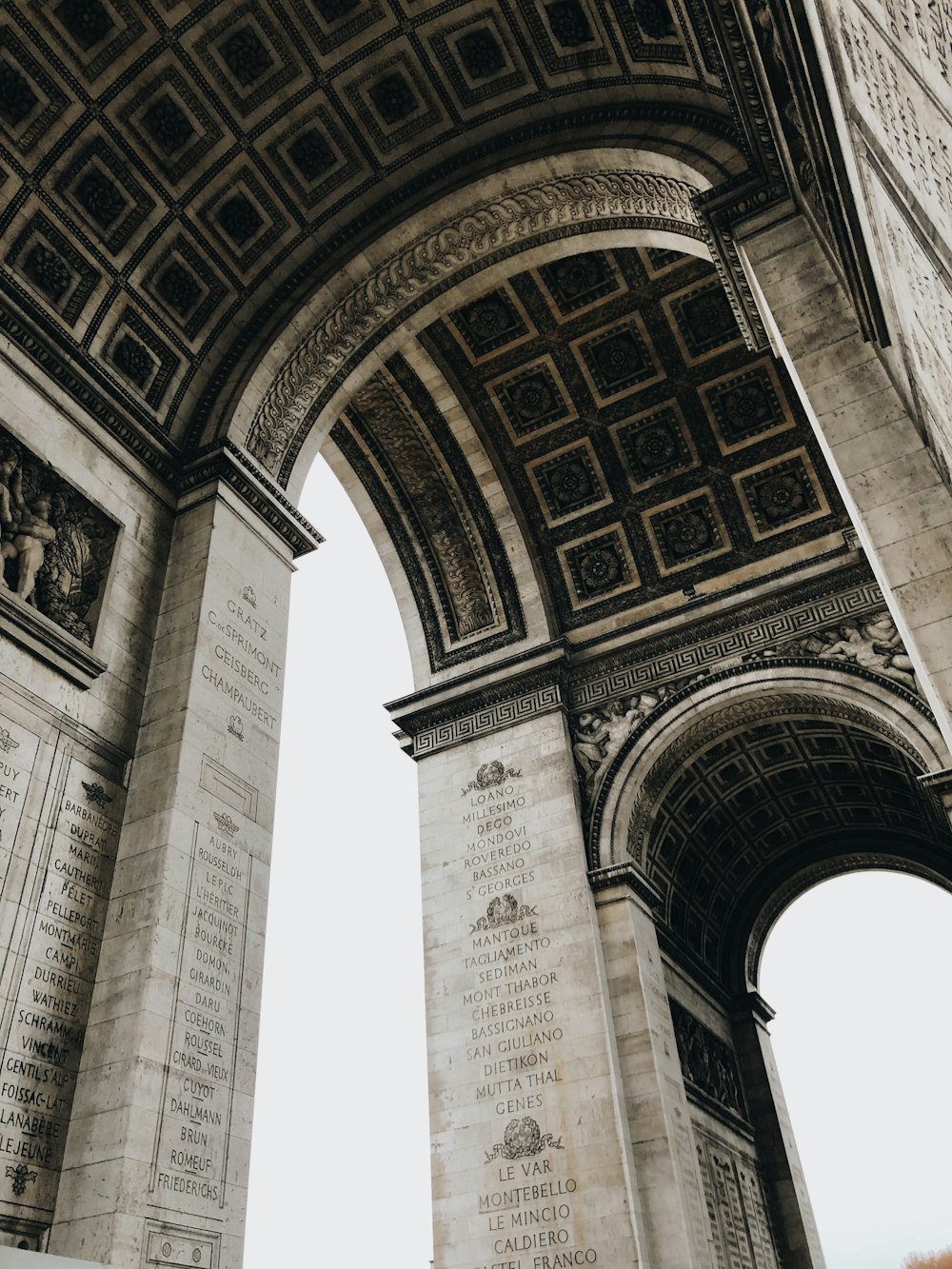 low angle photography of arc de triomphe