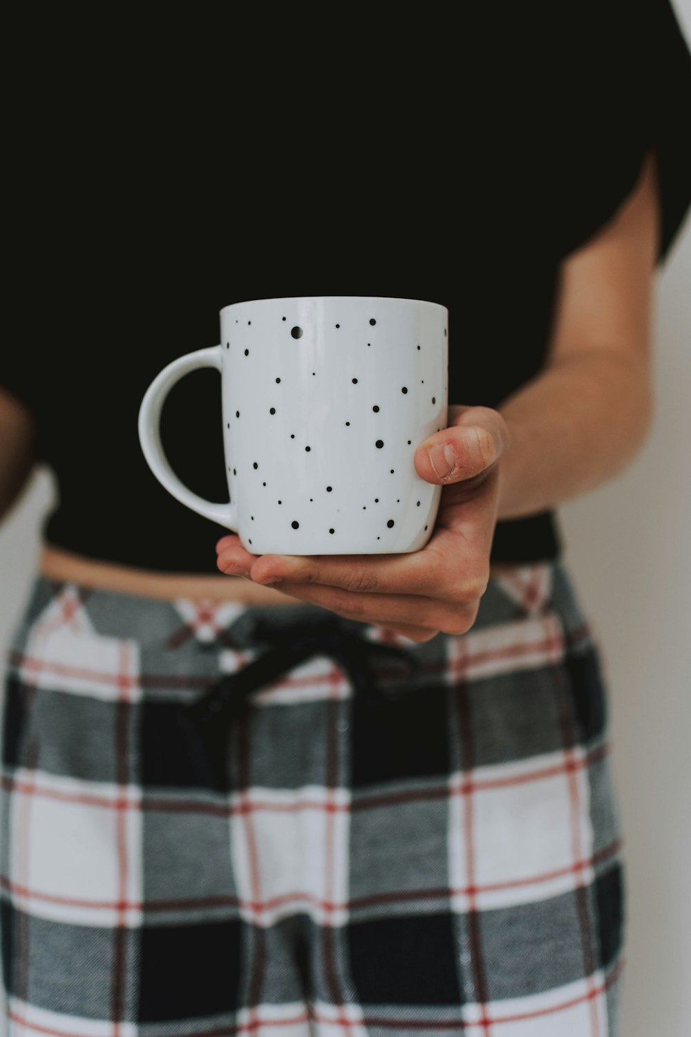 white and red ceramic mug