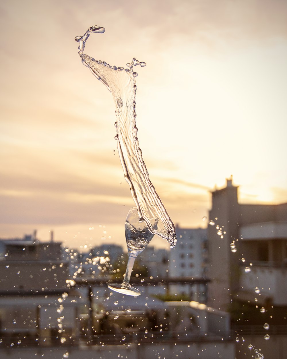 water drop on glass during sunset