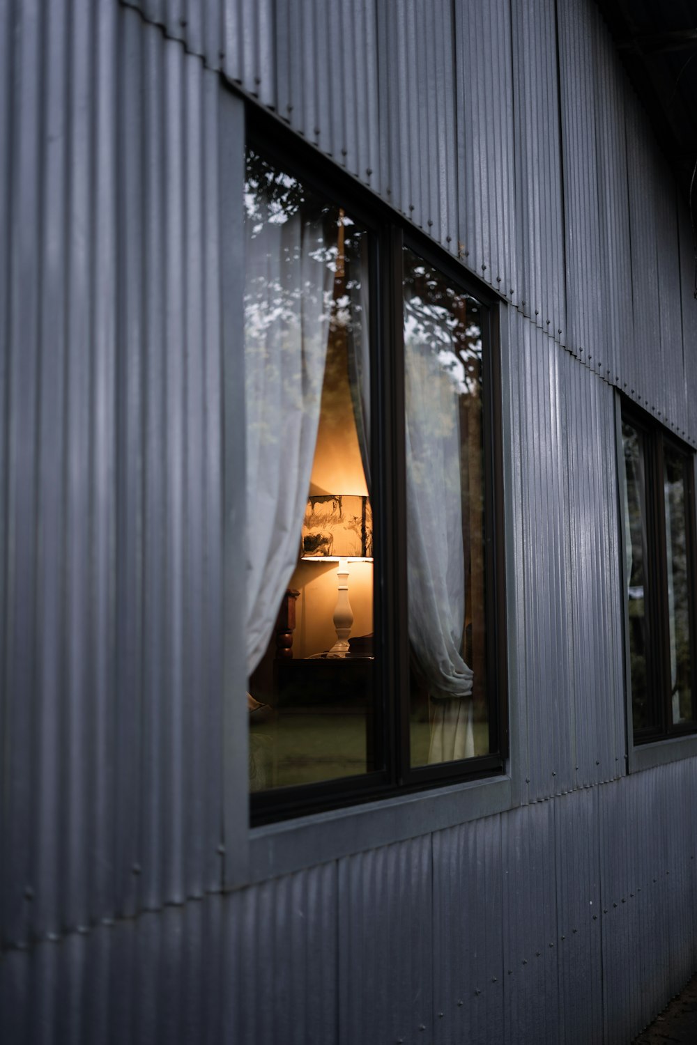 white window curtain near glass window