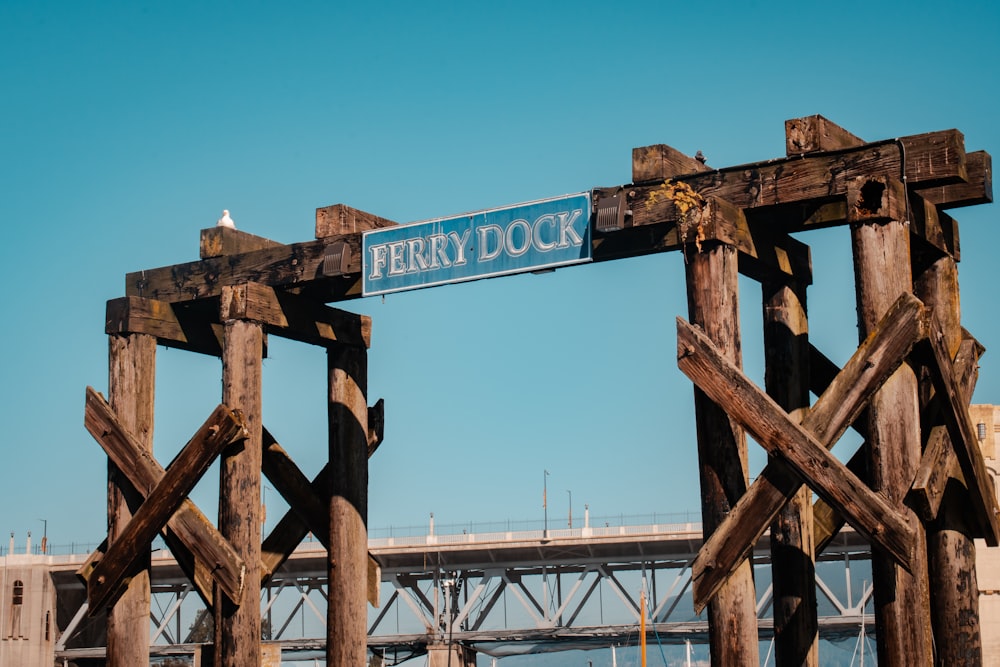a wooden structure with a sign that reads ferry dock