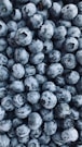 black round fruits on white surface