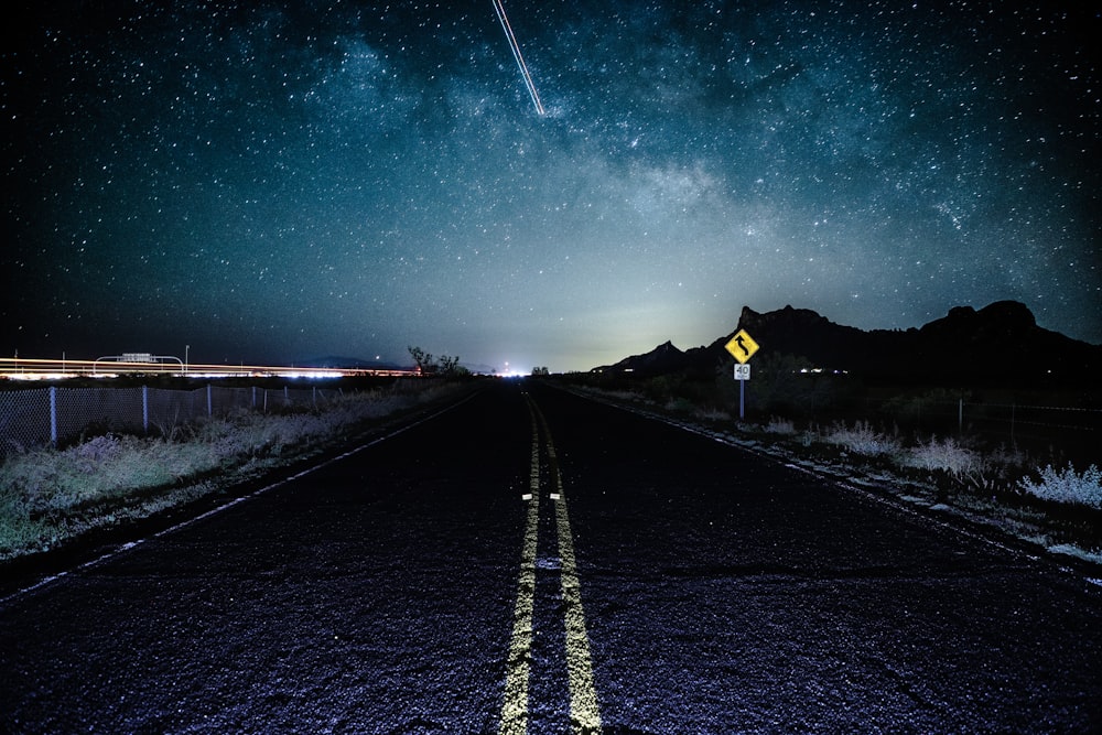 black and yellow road during night time