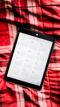 A calendar interface showing booked online classes with a tutor on a tablet screen.