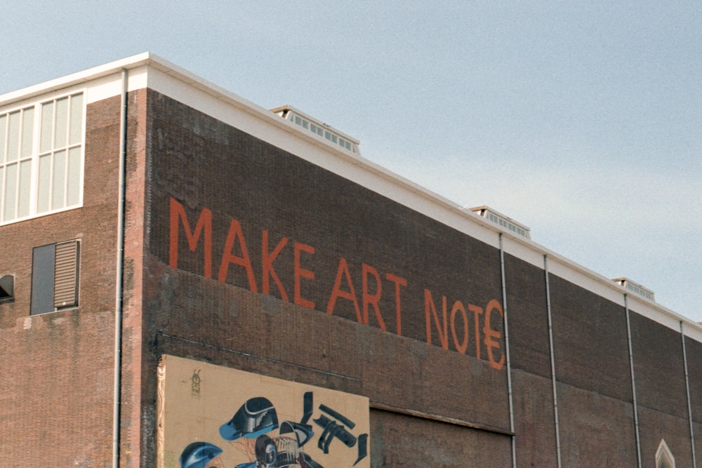 a brick building with graffiti on the side of it