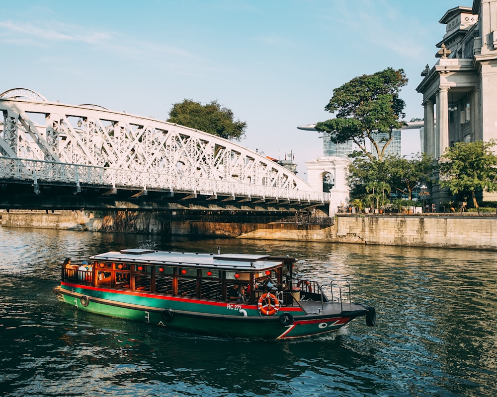 red and black boat on river during daytime