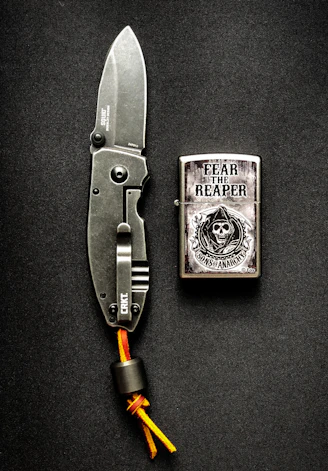 silver and black folding knife