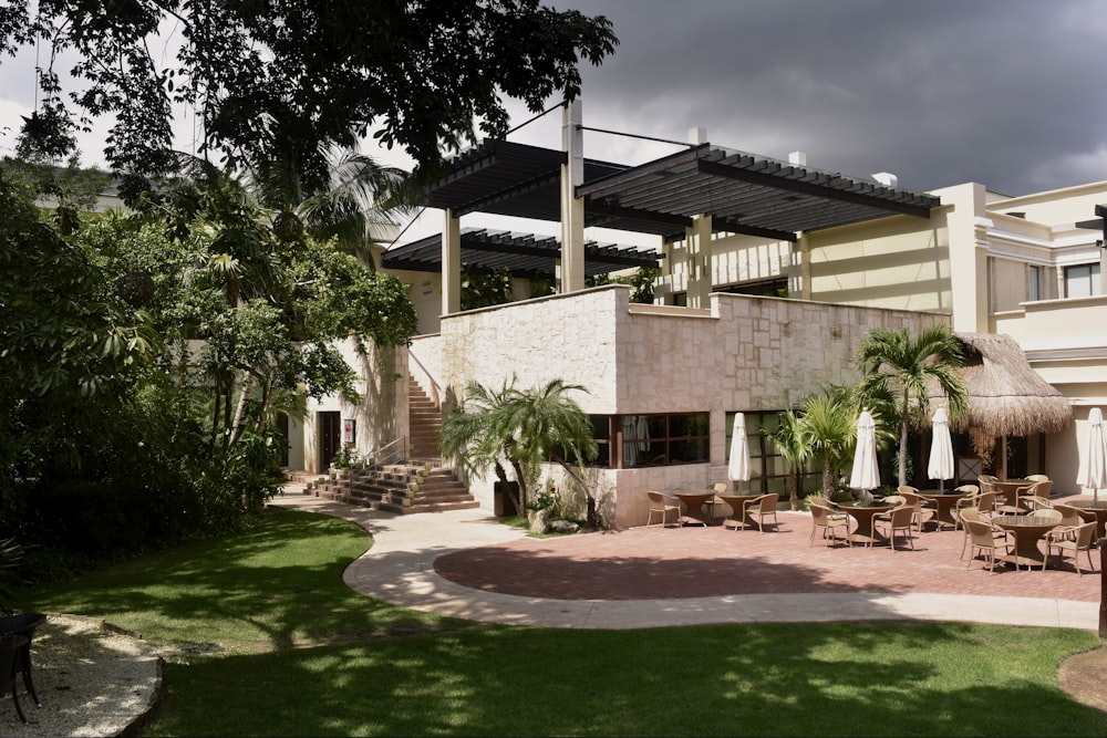 green grass lawn near brown concrete building during daytime