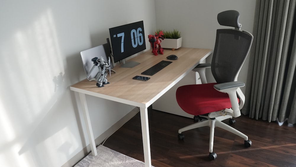 black flat screen tv on brown wooden table