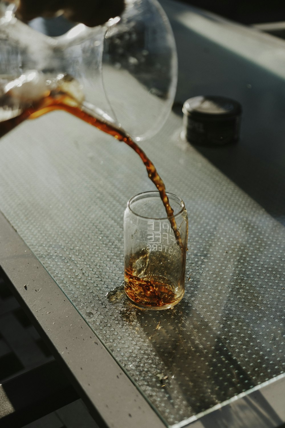 clear drinking glass on gray table