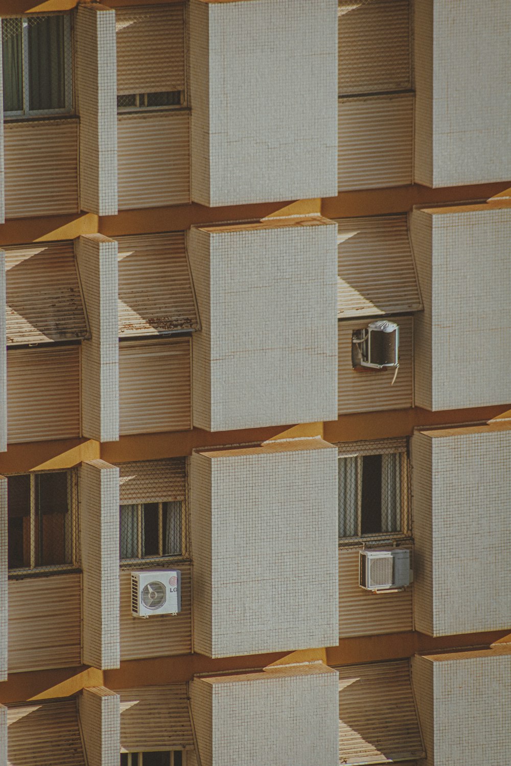 brown wooden window frame on white concrete wall