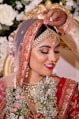 woman in red and gold floral hijab