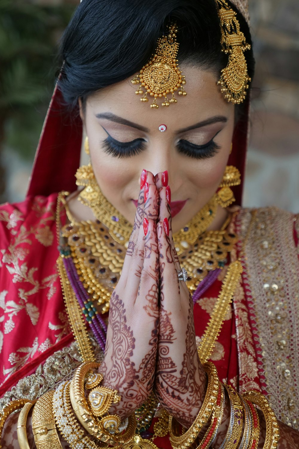 woman in red and gold traditional dress