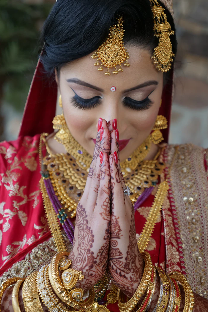 Close portrait of a bride in traditional gold bridal jewellery