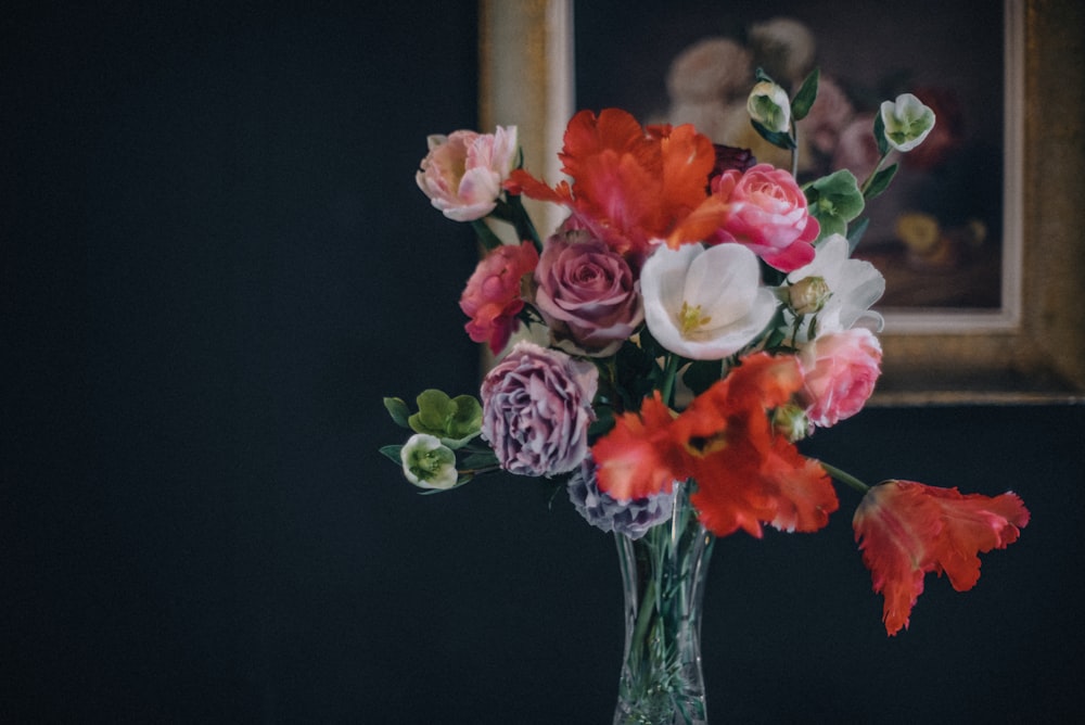 pink roses in clear glass vase