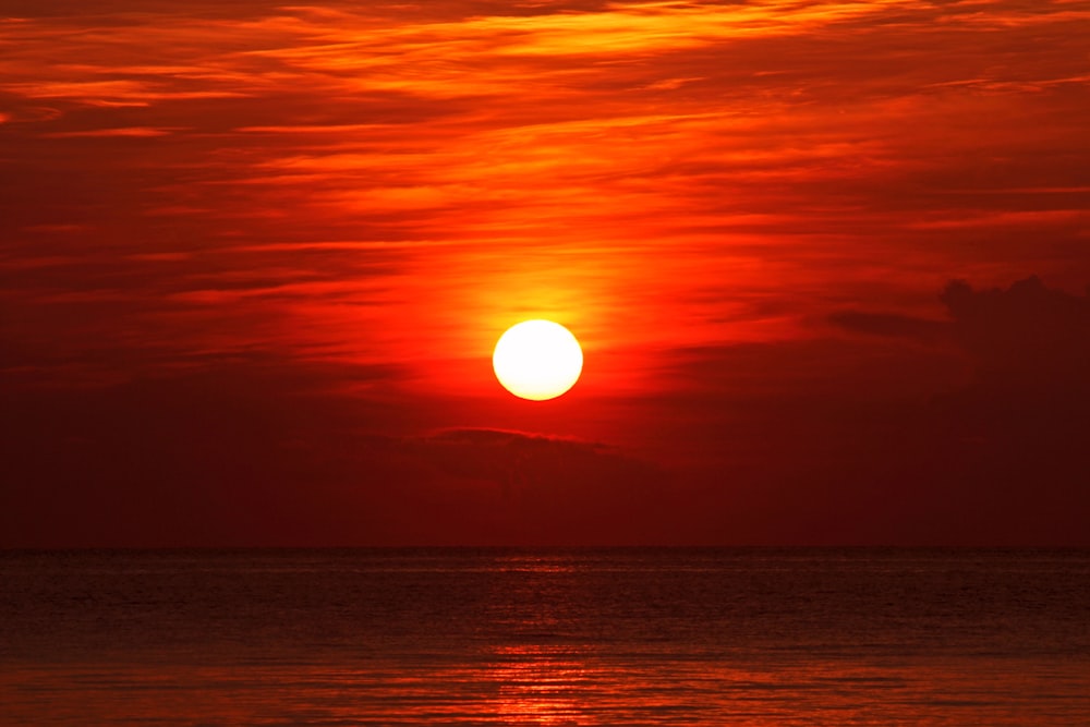 body of water during sunset