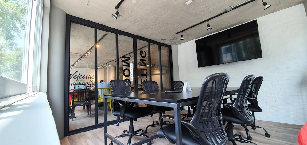 black wooden table and chairs