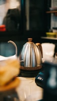 Close-up of a kettle's ergonomic handle and easy-pour spout, highlighting thoughtful design.