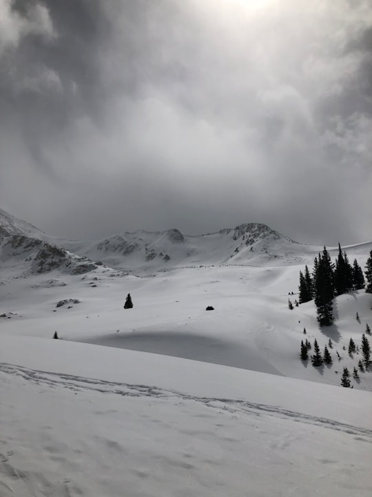 snow covered mountain under cloudy sky during daytime in White River National Forest United States