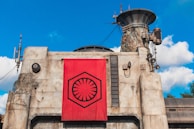 A wide shot of the exterior of a datanet-ai facility under a clear blue sky.