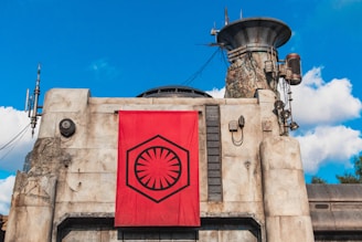 A wide shot of the exterior of a datanet-ai facility under a clear blue sky.