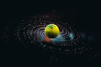 green and yellow ball on water