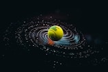 green and yellow ball on water