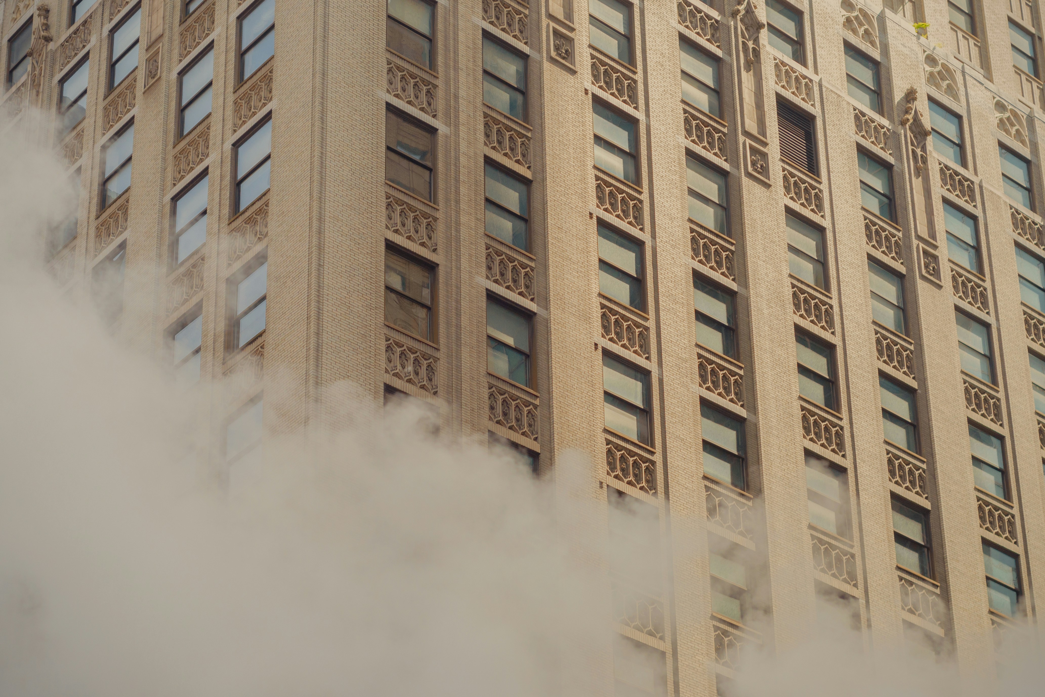 brown concrete building with white smoke