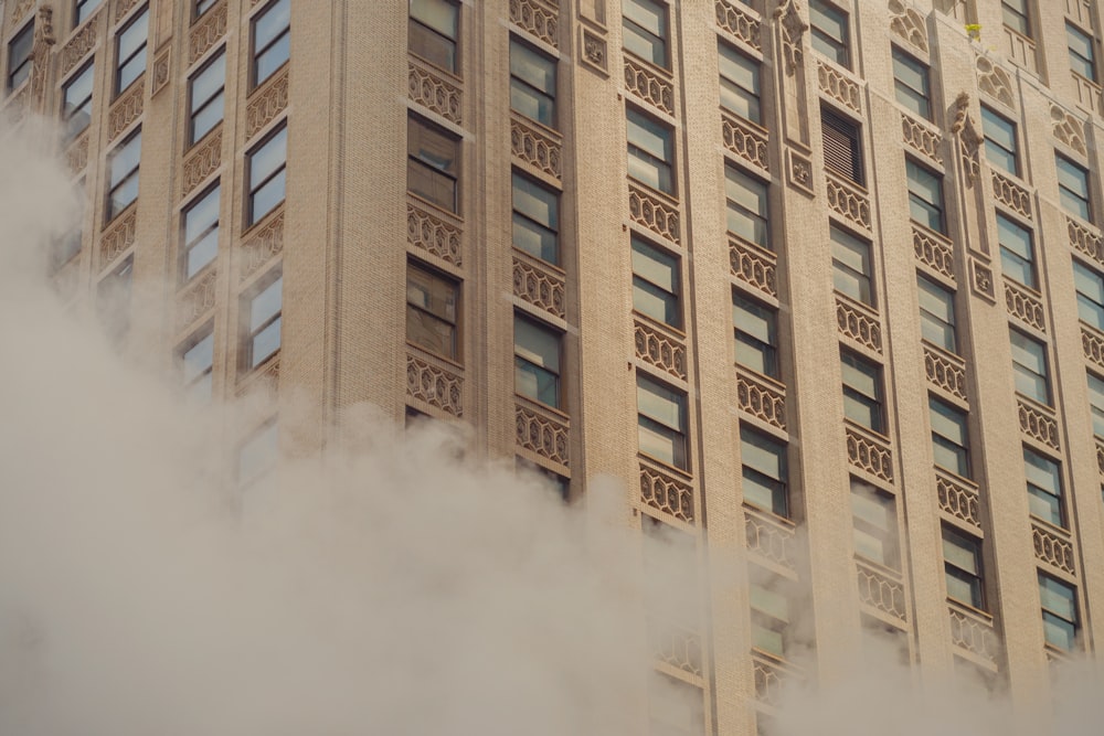 brown concrete building with white smoke