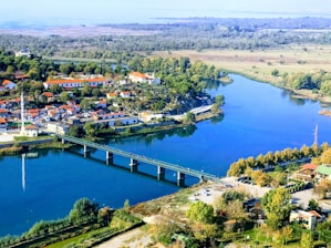aerial view of city near body of water during daytime