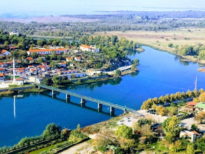 aerial view of city near body of water during daytime