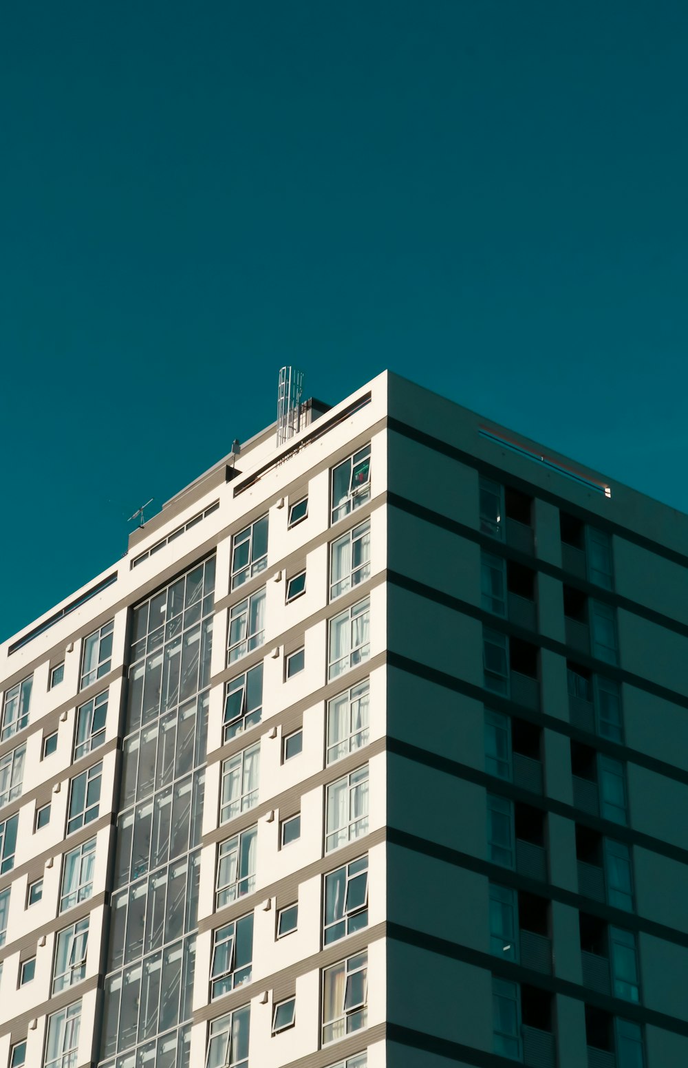 white concrete building under blue sky during daytime