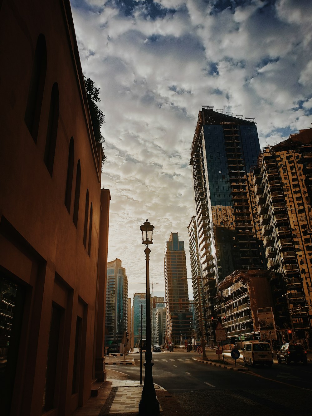 brown concrete building under cloudy sky during daytime