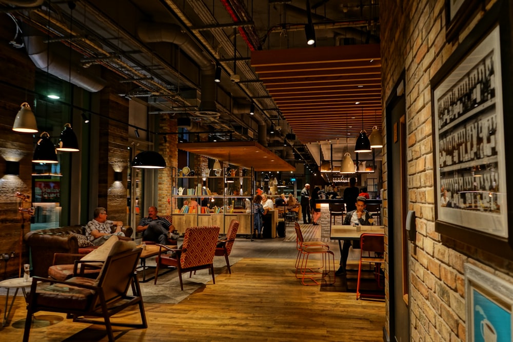 people sitting on chairs and tables in restaurant