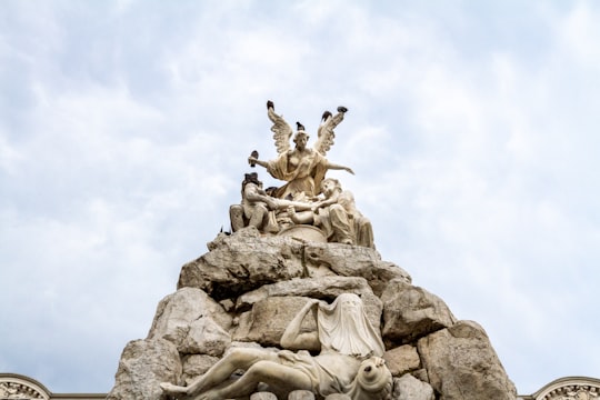 gray concrete statue under white sky during daytime in Trieste Italy