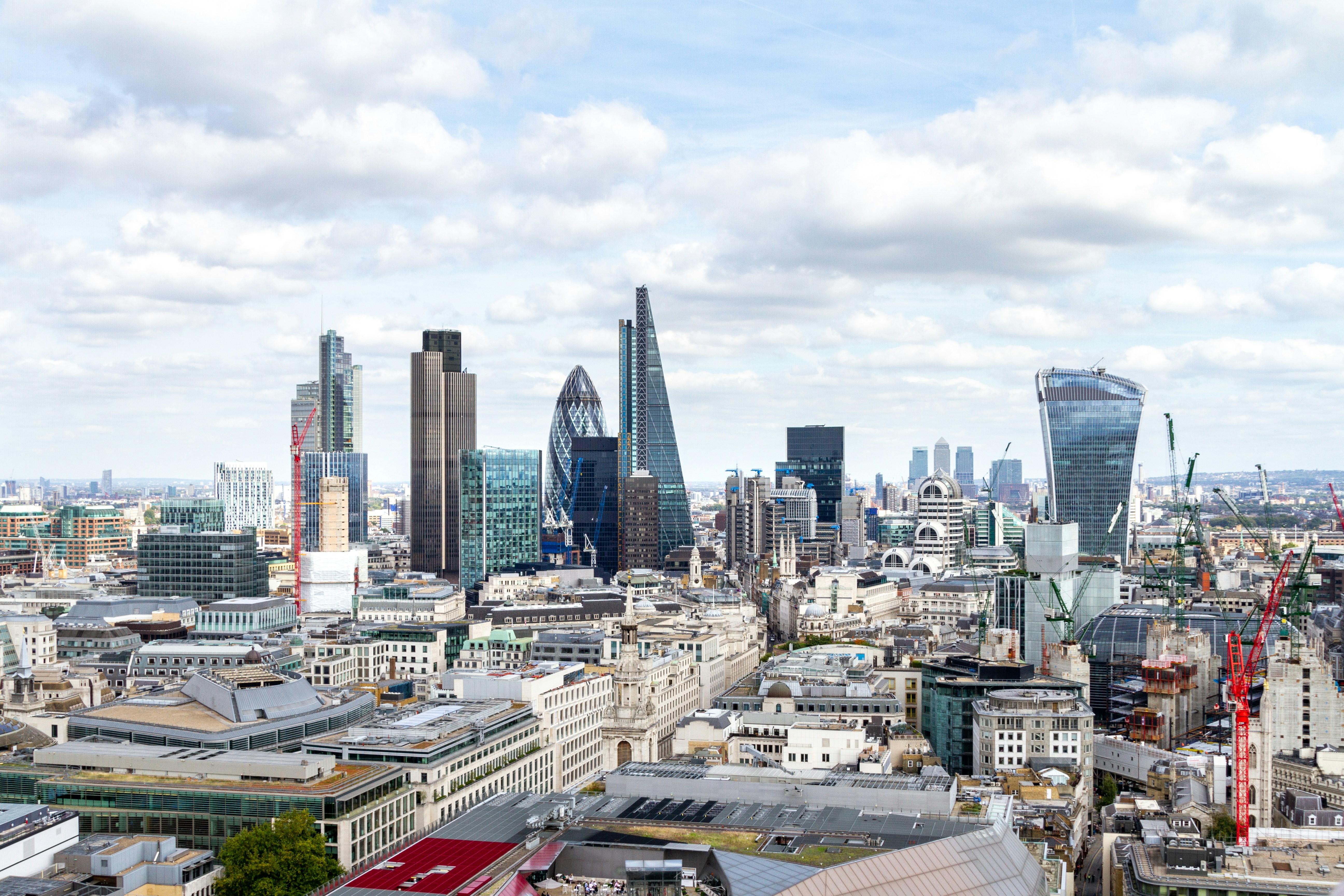 city buildings under white cloudy sky during daytime