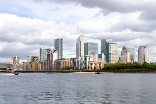 city skyline across body of water during daytime in Canary Wharf United Kingdom