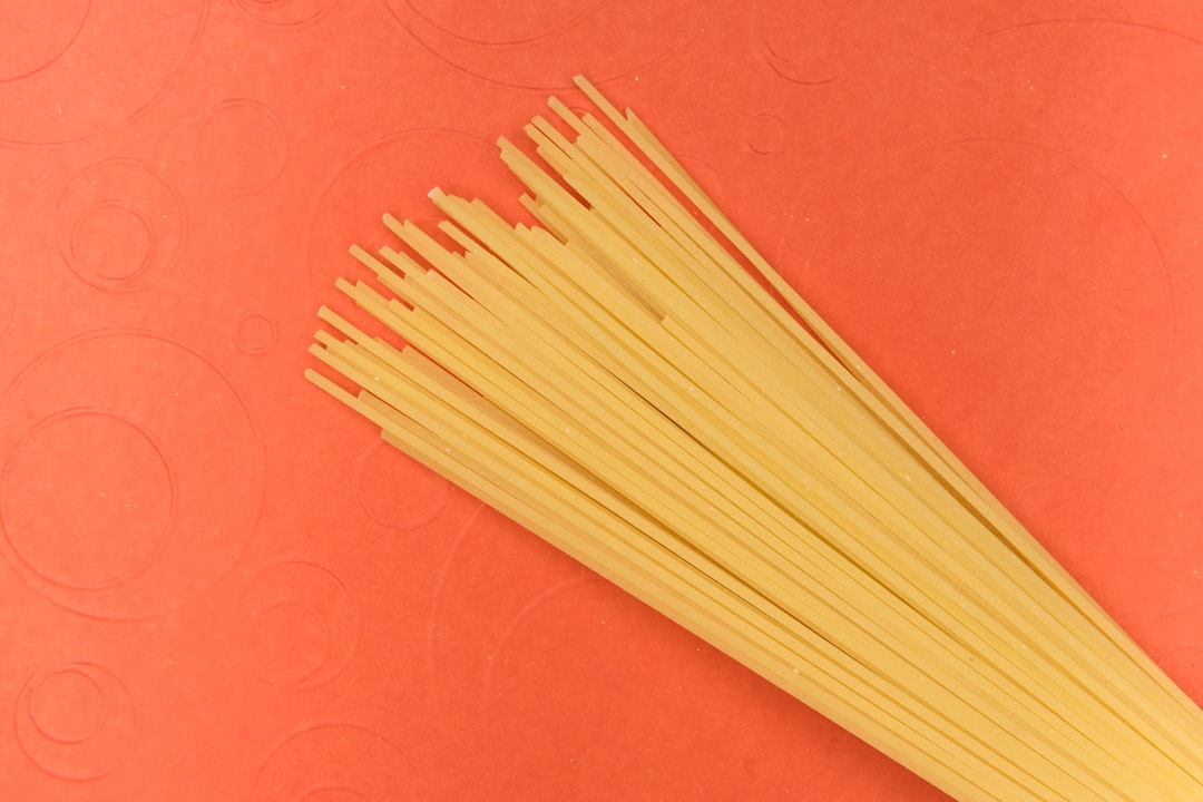 brown wooden sticks on red textile