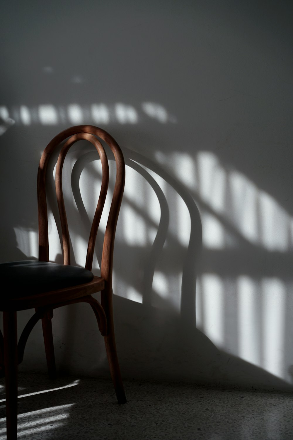 brown wooden chair beside table