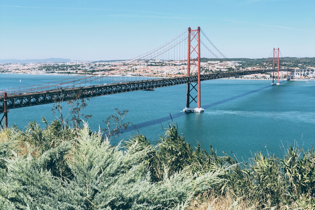 Suspension bridge photo spot Almada São Julião beach